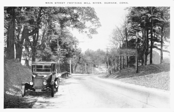 Reprinted from <a data-cke-saved-href='/Products/9780738573267' href='/Products/9780738573267'>Durham 1900 – 1950</a> by the Durham Historical Society, courtesy of FEK (pg. 25, Arcadia Publishing, 2010). This 1934 postcard shows Main Street in Durham, Connecticut.