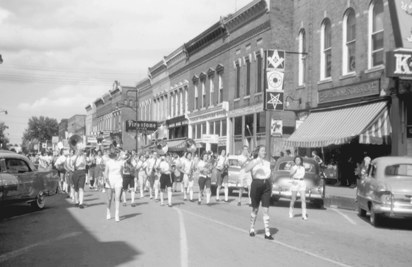 Reprinted from <a data-cke-saved-href='/Products/9780738586564' href='/Products/9780738586564'>Campbellsville</a> by Joseph Y. DeSpain, John R. Burch Jr., and Timothy Q. Hooper, courtesy of TCHS (pg. 9, Arcadia Publishing, 2010). Gayle Creel walks ahead of the Campbellsville High School Band in Campbellville’s 1957 Fourth of July parade.