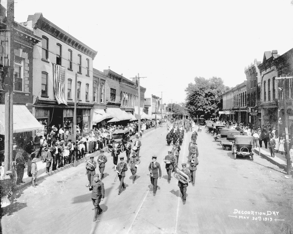 Reprinted from <a data-cke-saved-href='/Products/9780738577968' href='/Products/9780738577968'>Northville</a> by Michele M. Fecht (pg. 52, Arcadia Publishing, 2010). This 1919 photo shows a band leading World War I soldiers through the town of Northville, Michigan.