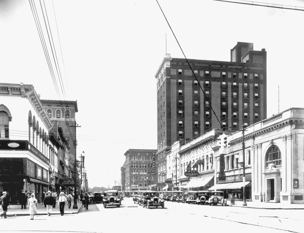Reprinted from <a data-cke-saved-href='/Products/9780738515663' href='/Products/9780738515663'>Remembering Greenville</a> by the Greenville County Historical Society (pg. 20, Arcadia Publishing, 2006). This 1920s photo shows the Poinsett Hotel towering over Main Street in Greenville, South Carolina.