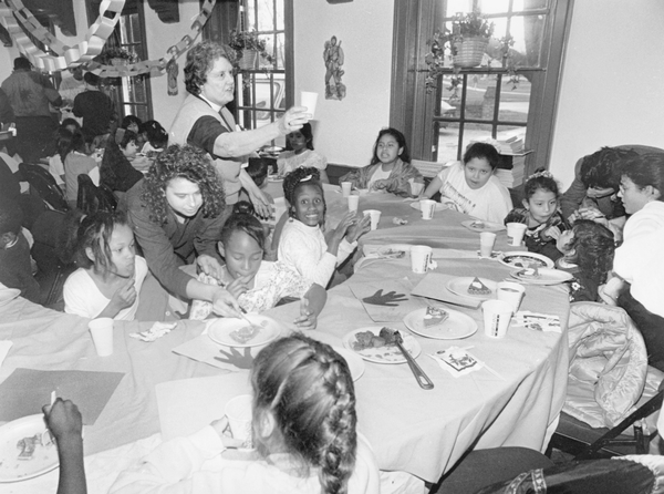 A group of children are hosted for a pre-Thanksgiving dinner at the University of Maryland.