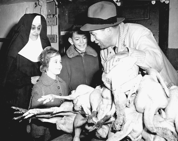 Orphaned children examined donated turkeys for Thanksgiving,