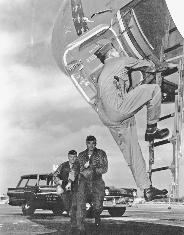 In this staged photo, a three-man B-47 alert crew arrives at their aircraft.
