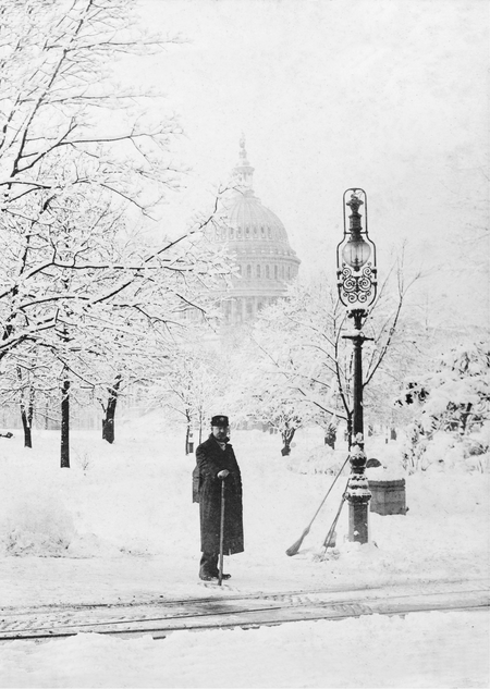 An attendant waits to fix telegraph wires during an 1888 blizzard in Washington, D.C.